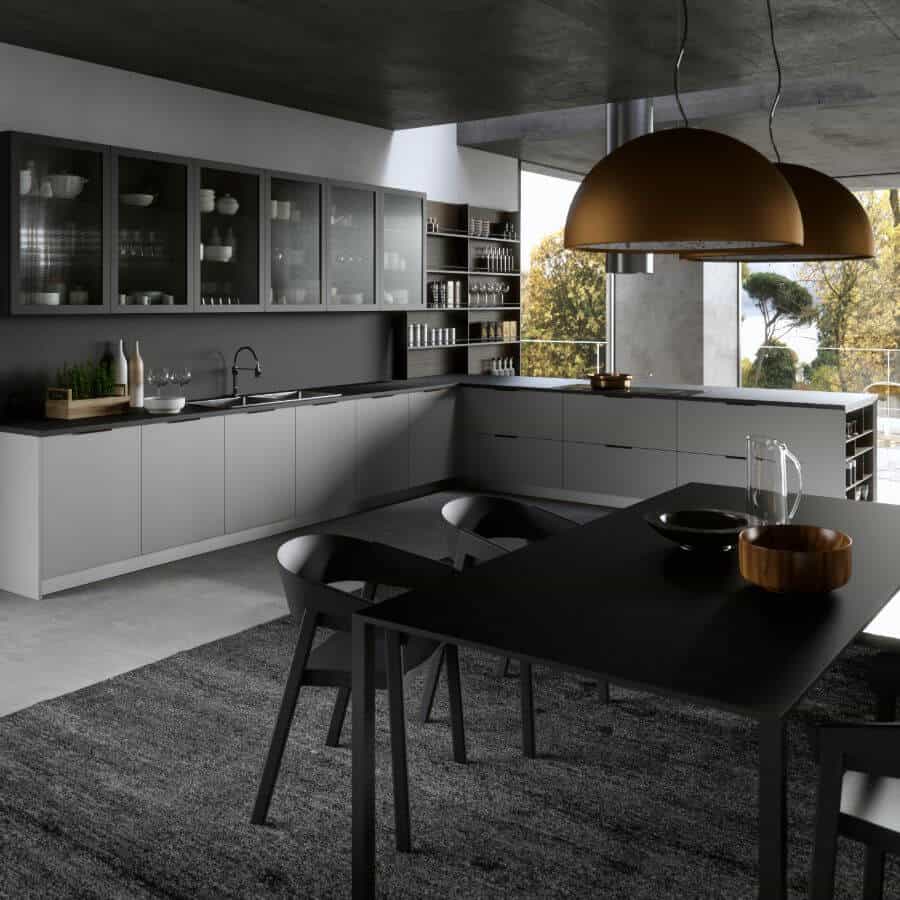 Cucina angolare di colorazione grigia con tavolo nero centrale