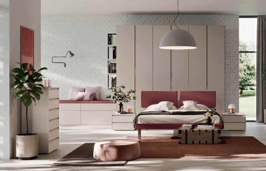 Una camera da letto con complementi d'arredo in colore cipria e rosa 